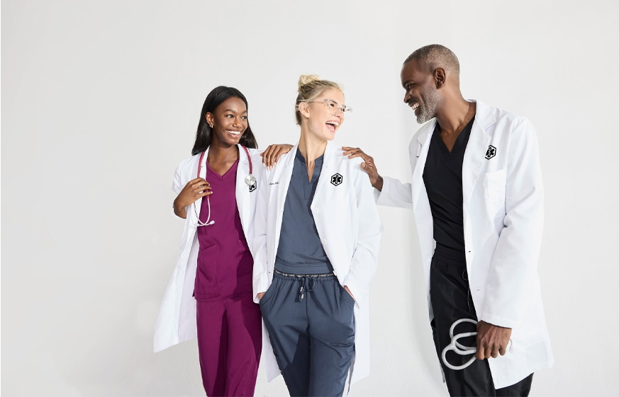 Medical professionals in scrubs and tailored lab coats